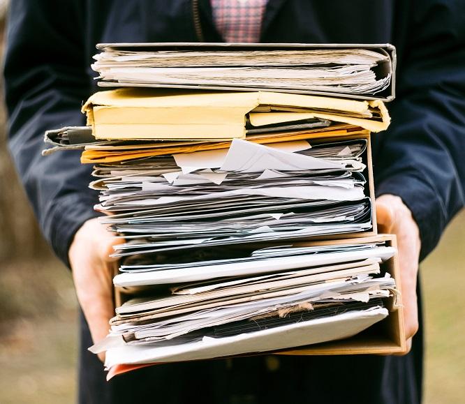 person holding folders
