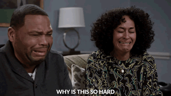 black man and woman crying