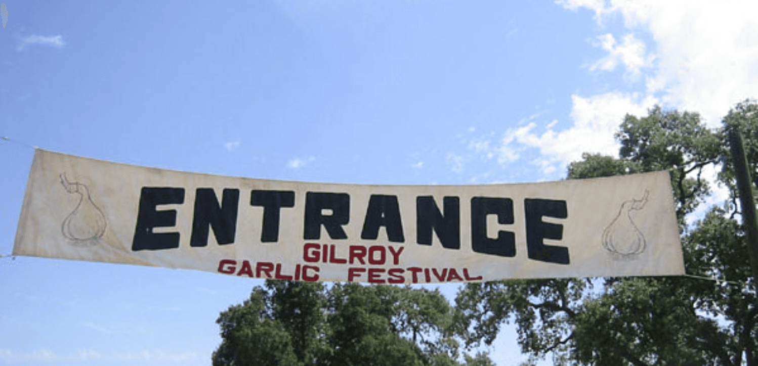 Sign that reads "Entrance Gilroy Garlic Festival"